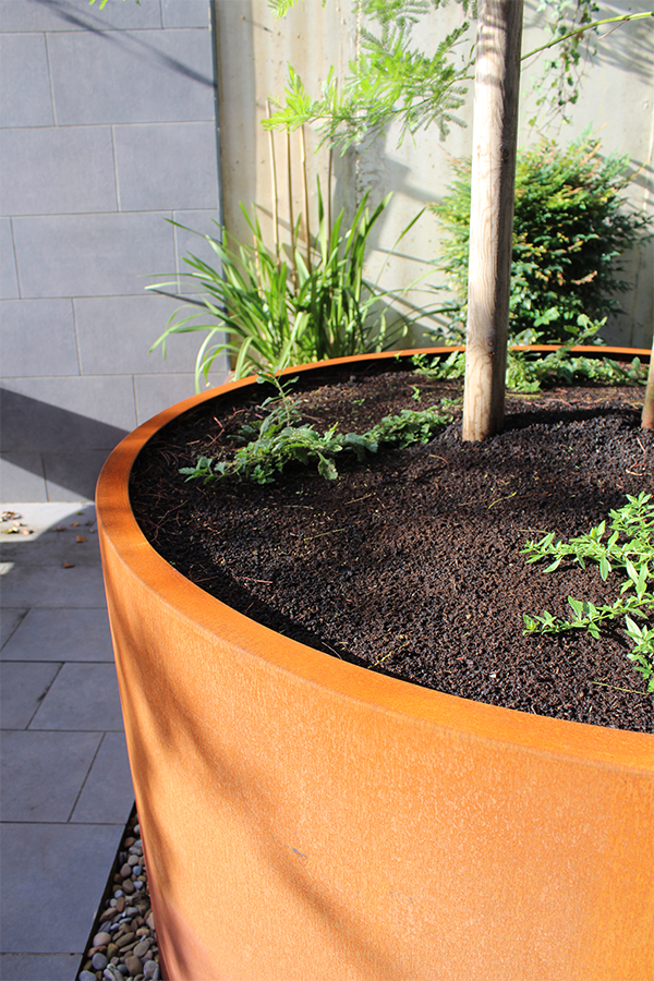 jardineras_circulares_en_acero_corten_para_exteriores.jpg